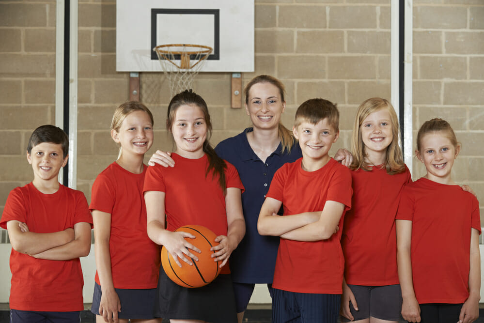 Portrait Of Elementary School Basketball Team With Coach Portrait Of Elementary School Basketball Team With Coach